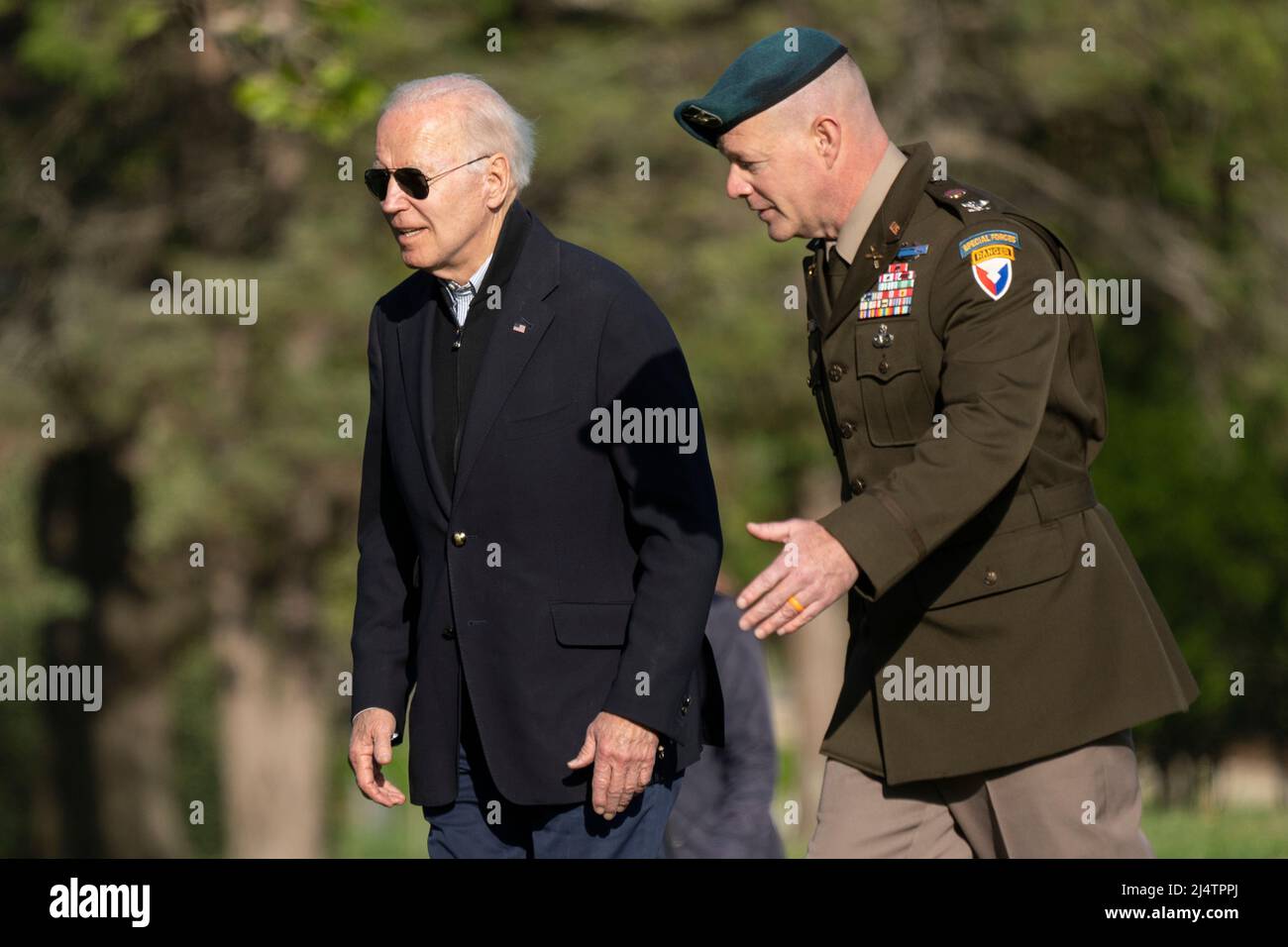 United States President Joe Biden, escorted by Col. David D. Bowling,  Commander, Joint Base Myer-Henderson Hall walks to his motorcade from  Marine One at Ft. McNair in Washington, DC, to board their