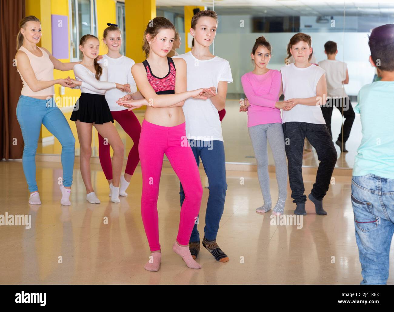 Children dancing rockandroll in pairs in choreography class wi Stock
