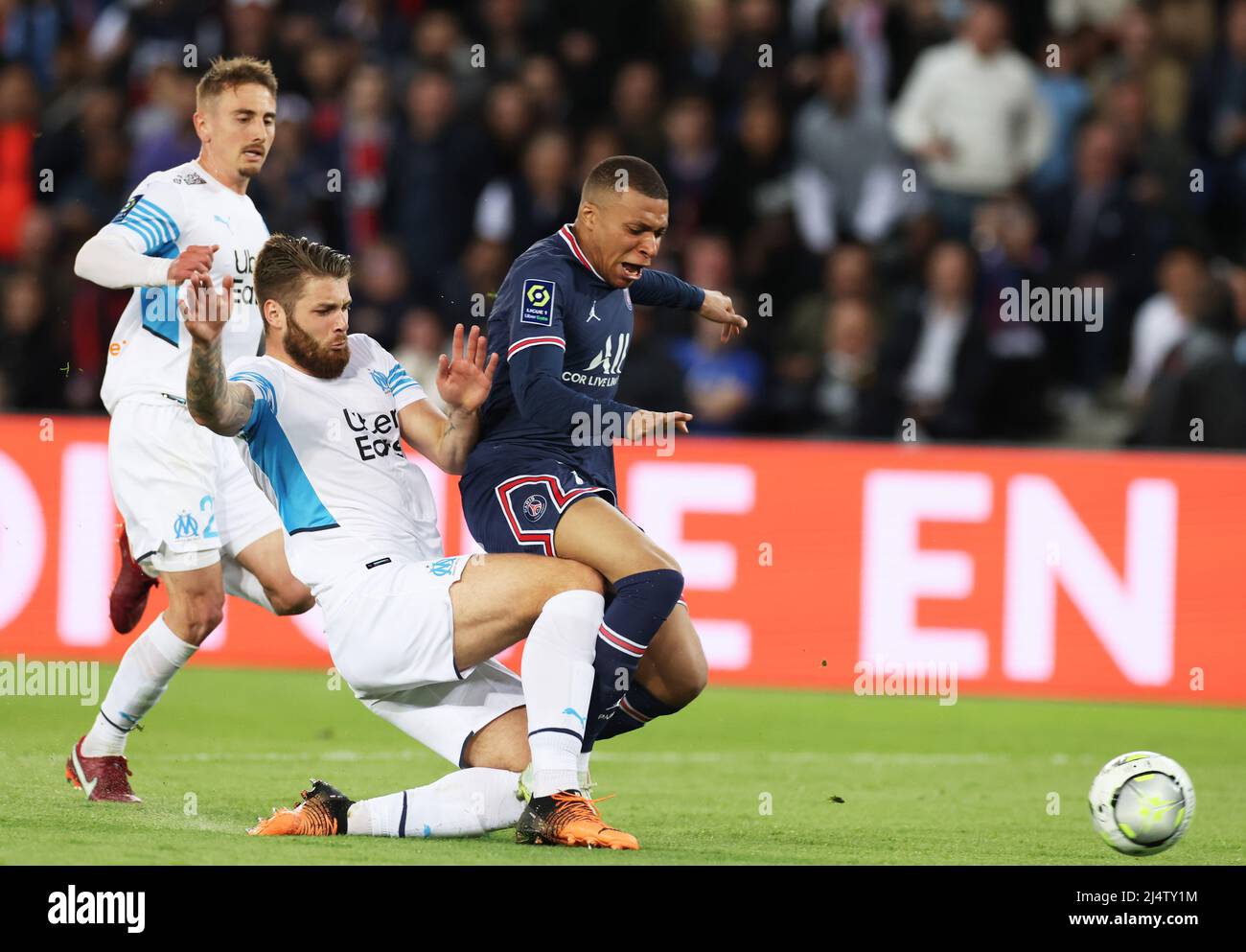Paris, France. 17th Apr, 2022. Paris Saint Germain's Kylian Mbappe (R) vies with Marseille's Duje Caleta-Car (C) during a French Ligue 1 football match between Paris Saint Germain (PSG) and Marseille in Paris, France, April 17, 2022. Credit: Gao Jing/Xinhua/Alamy Live News Stock Photo
