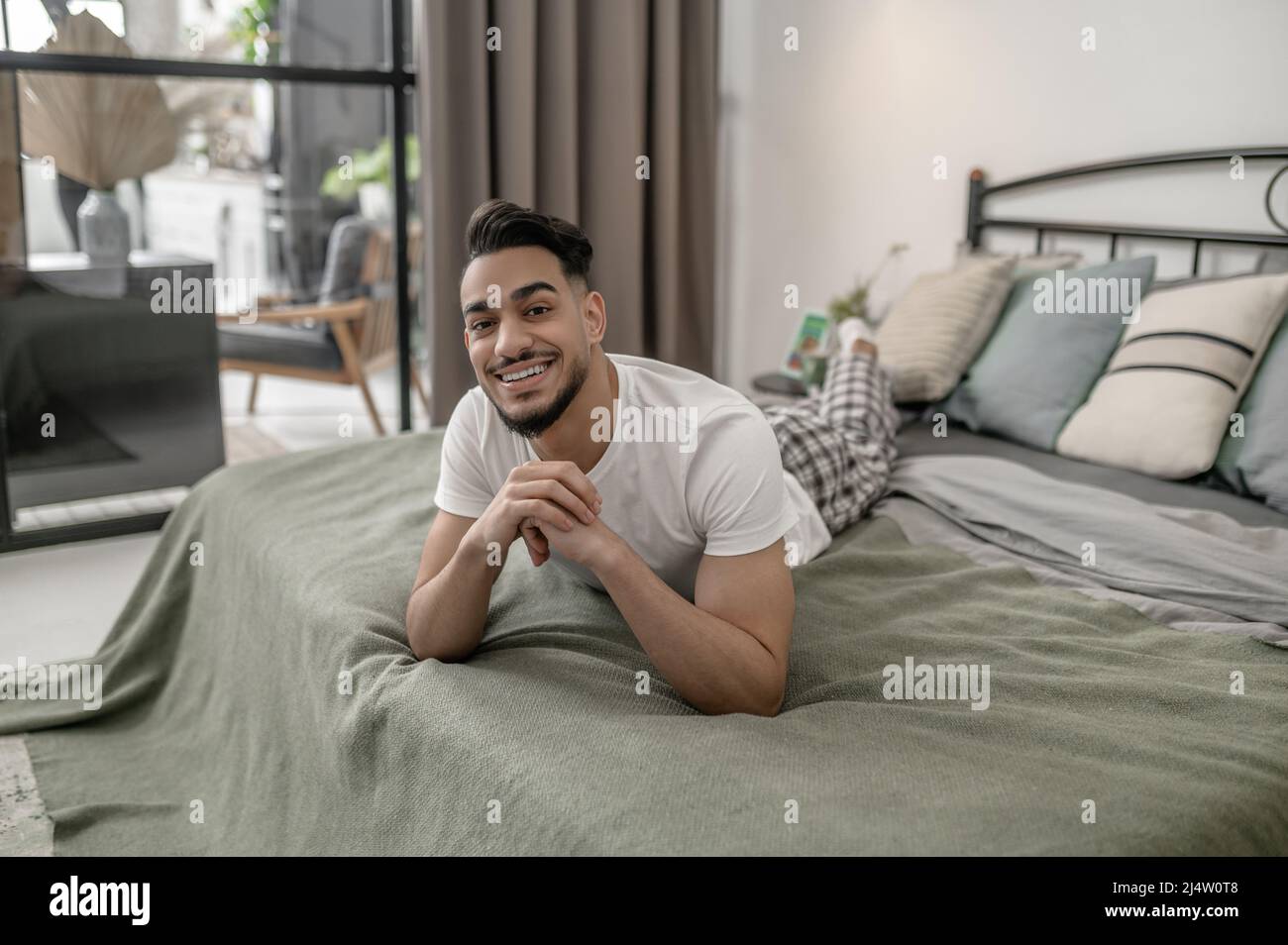 A young man spening day at home and feeling relaxed Stock Photo