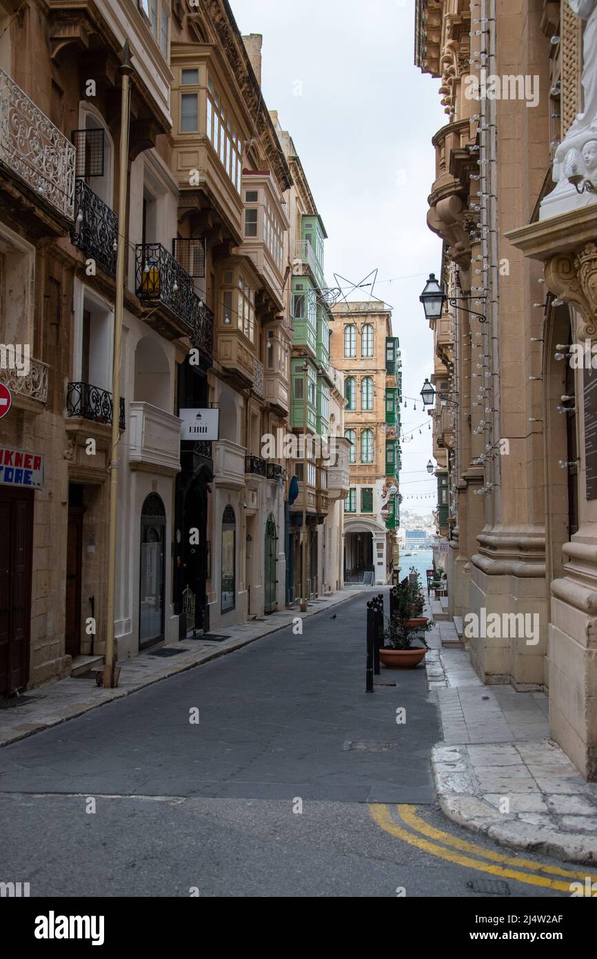 The narrow streets lined with "gallarija" colorful window boxes in