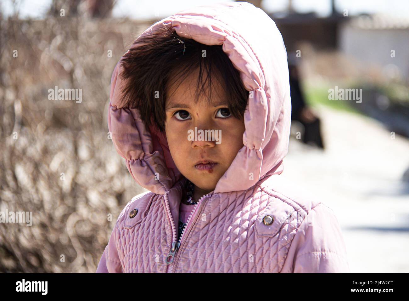 An Afghan girl has hard life after immigration with his family Stock Photo