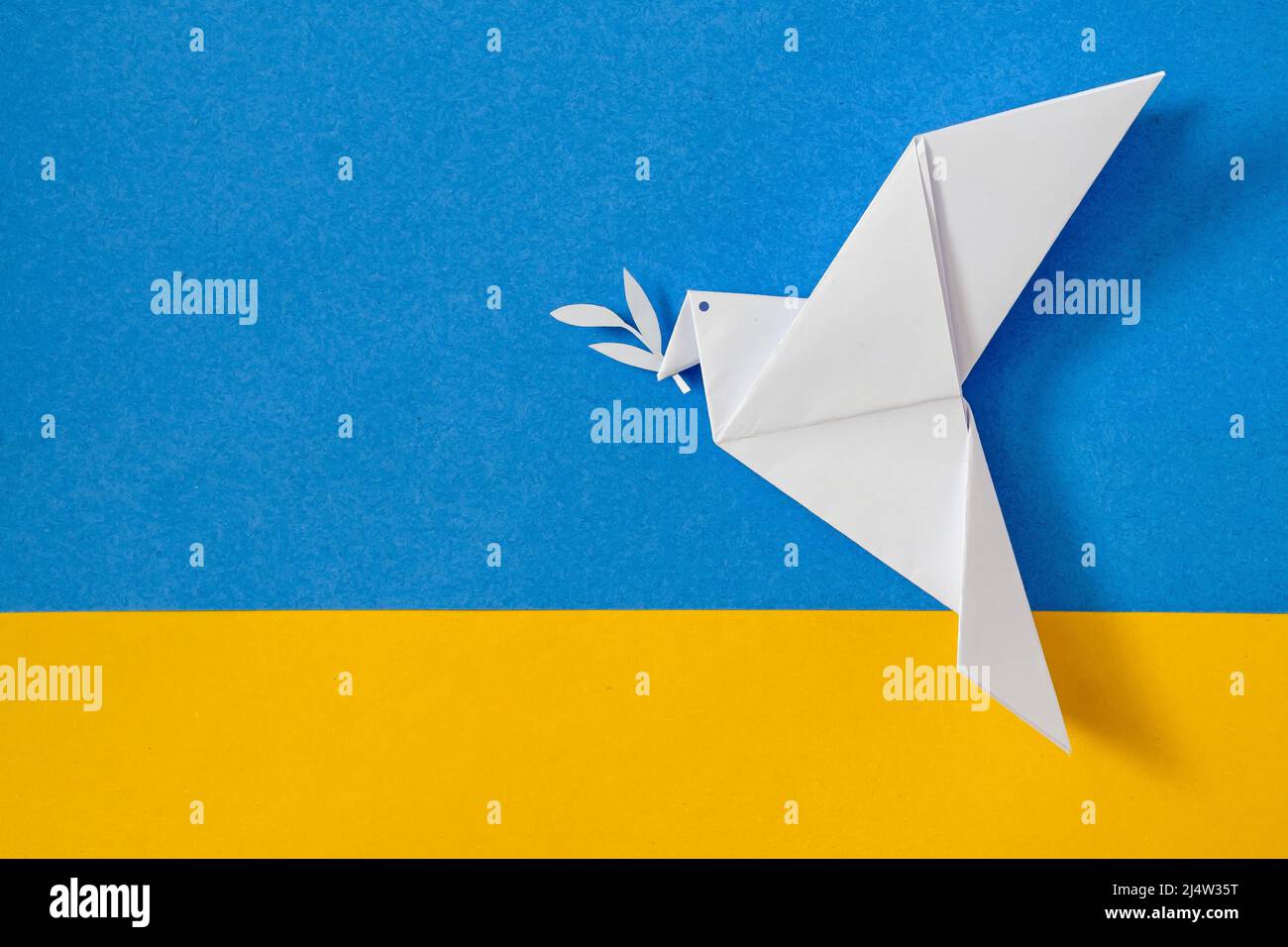 The dove of peace and the flag of Ukraine as a symbol of no war and conflict. Patriotism and politics so that there is national freedom and love. Stock Photo