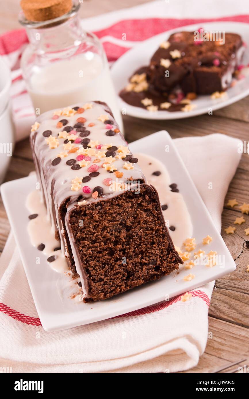 Sponge cake with white frosting and sugars Stock Photo Alamy