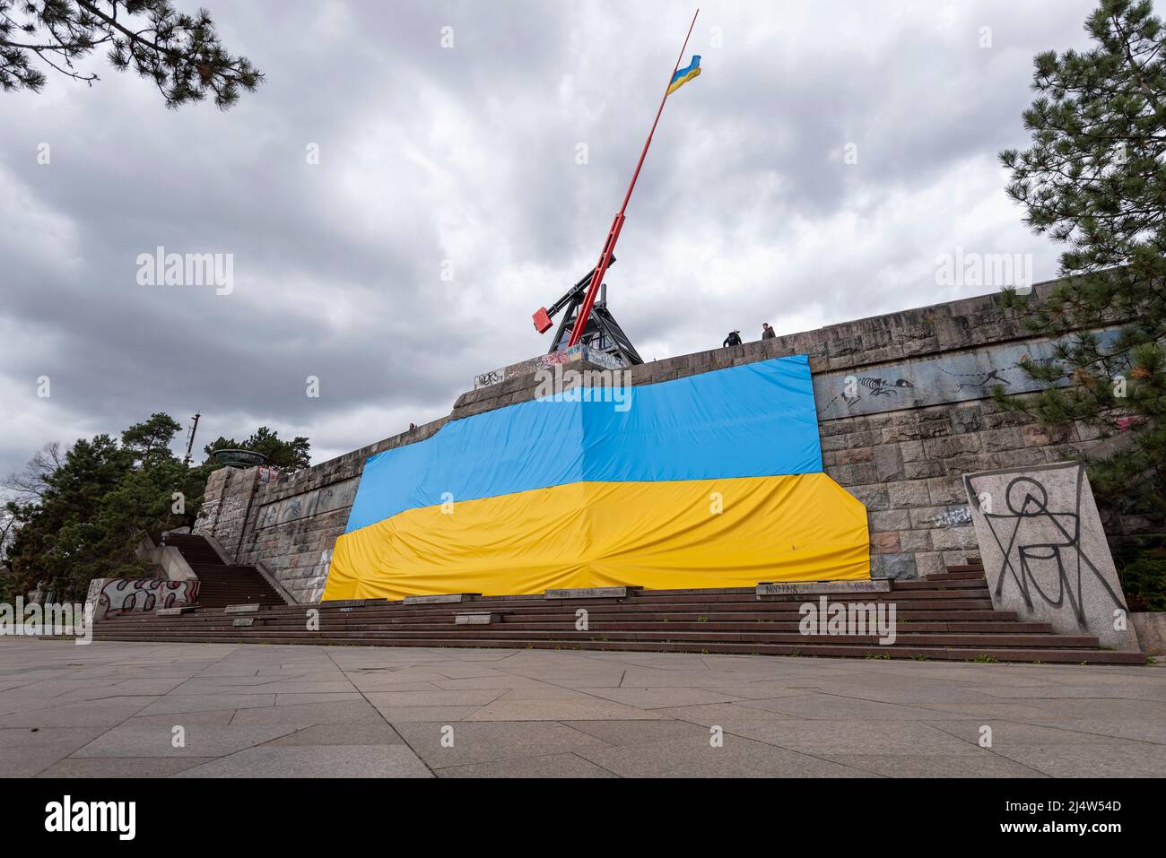 Ukrainian flag, hanging on the former Stalin monument in Prague, which was destroyed in 1962. Above it is the Prague Metronome, to which the Ukrainian Stock Photo