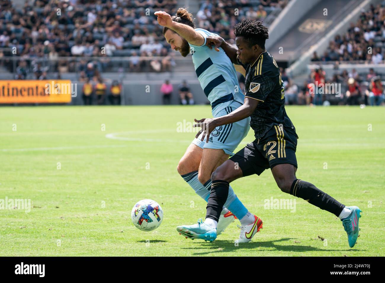 Los Angeles FC forward Kwadwo Opoku (22) and Sporting Kansas City midfielder Graham Zusi (8) battle for possession during a MLS match, Sunday, April 1 Stock Photo