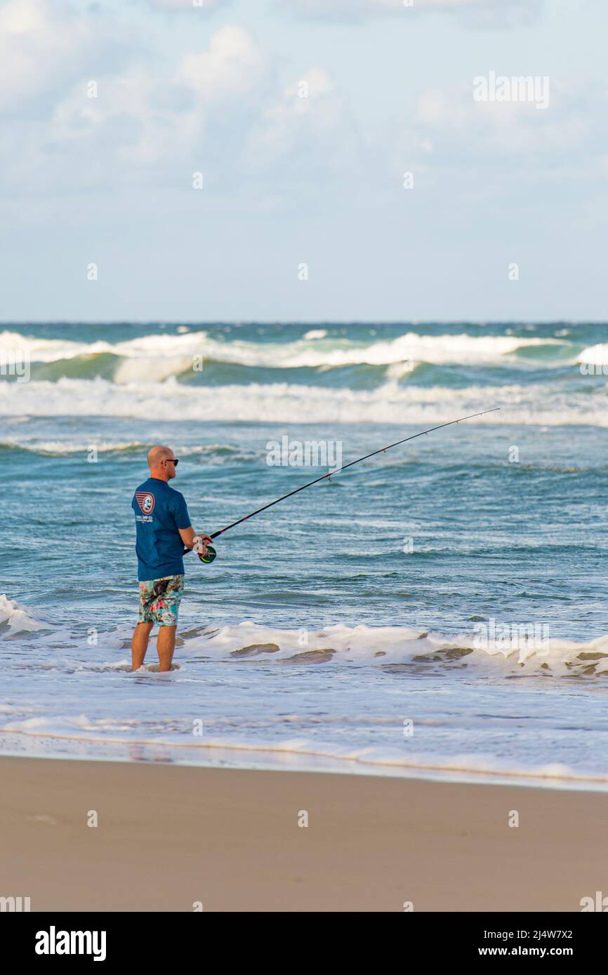 A fisherman on 75 Mile Beach on Fraser Island's east coast. Queensland, Australia. Stock Photo