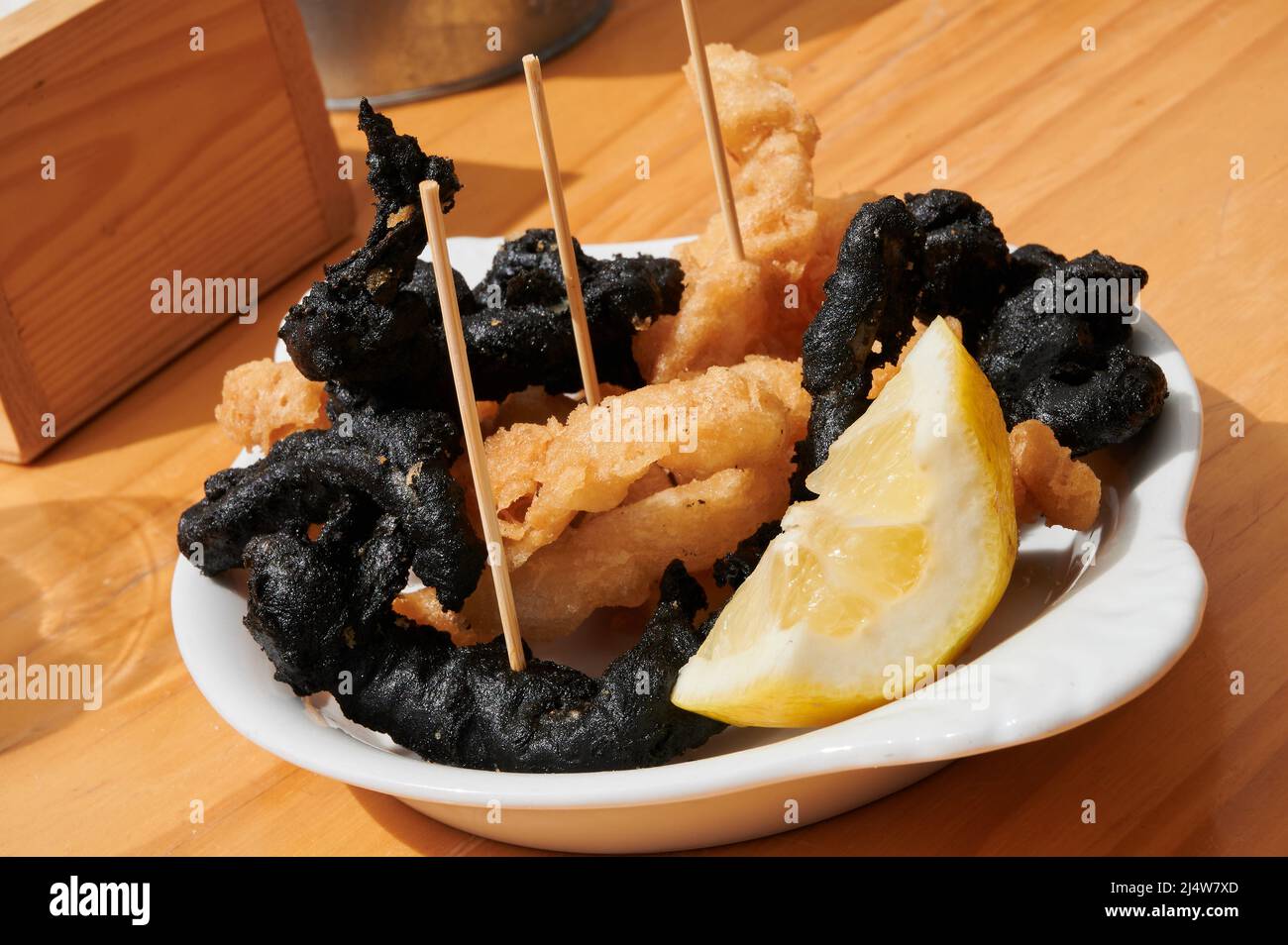Traditional Spanish-style crispy squid, some fried with squid ink and