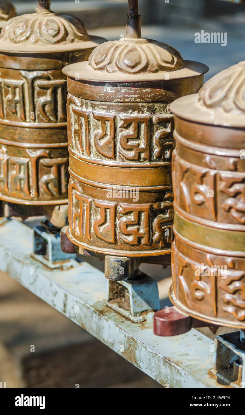 Brass Buddhist prayer wheels, Kathmandu, Nepal Stock Photo