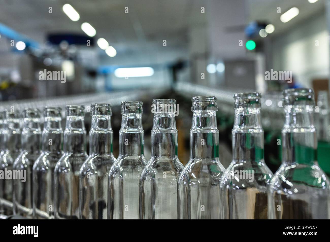 Row of glass bottles to fill with expensive alcohol drinks Stock Photo