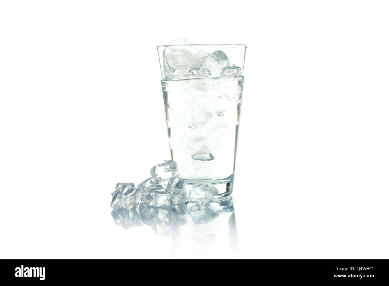Glass with water and ice isolated on white background Stock Photo