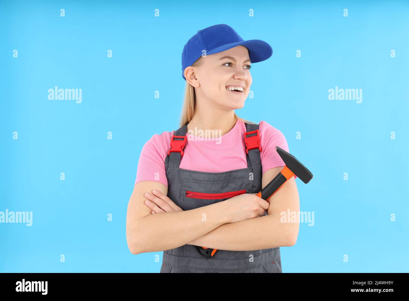 Concept of occupation, young woman on blue background Stock Photo