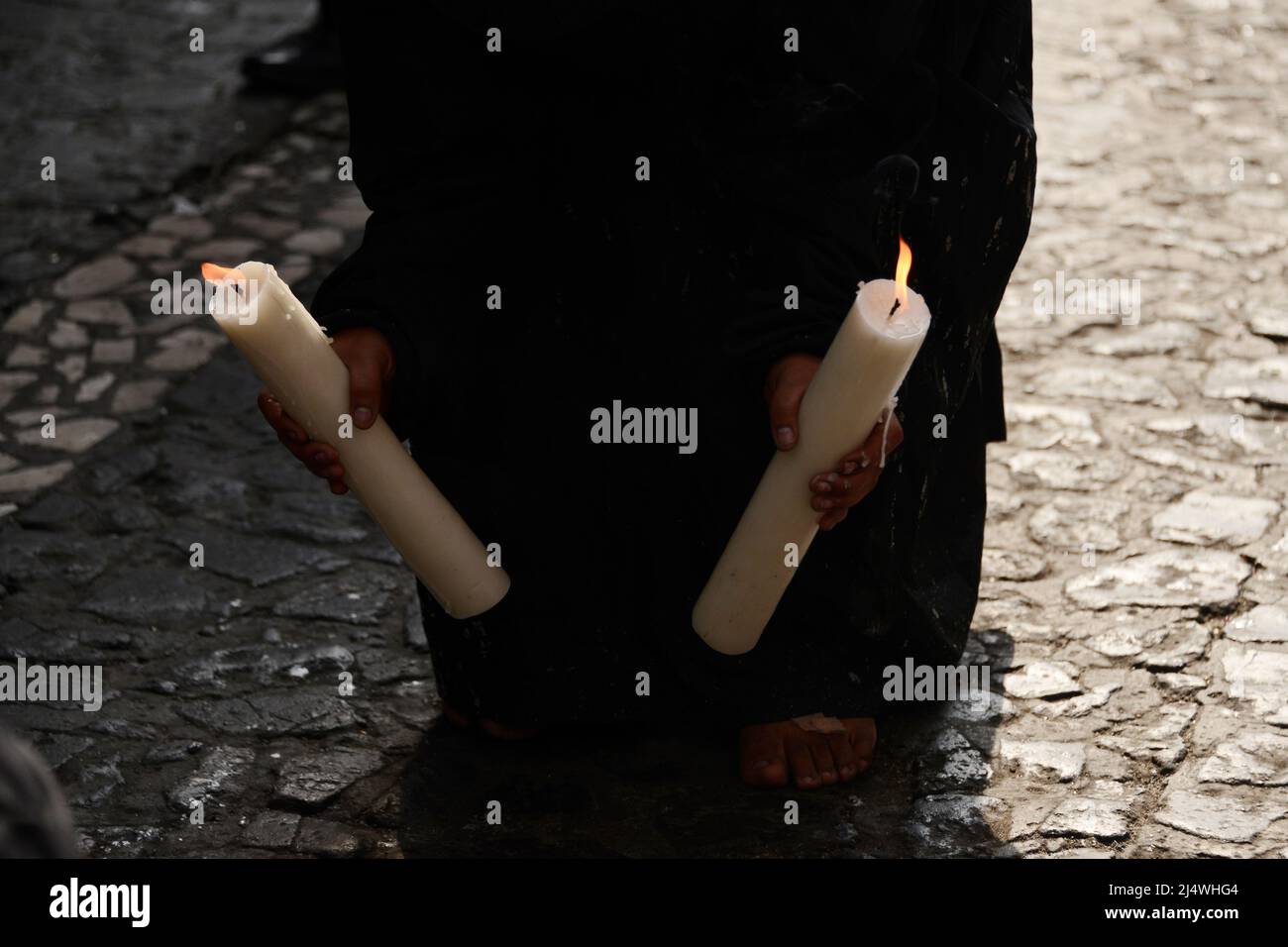 Non Exclusive: TAXCO, MEXICO - APR 15, 2022: A woman penitent wears a ...