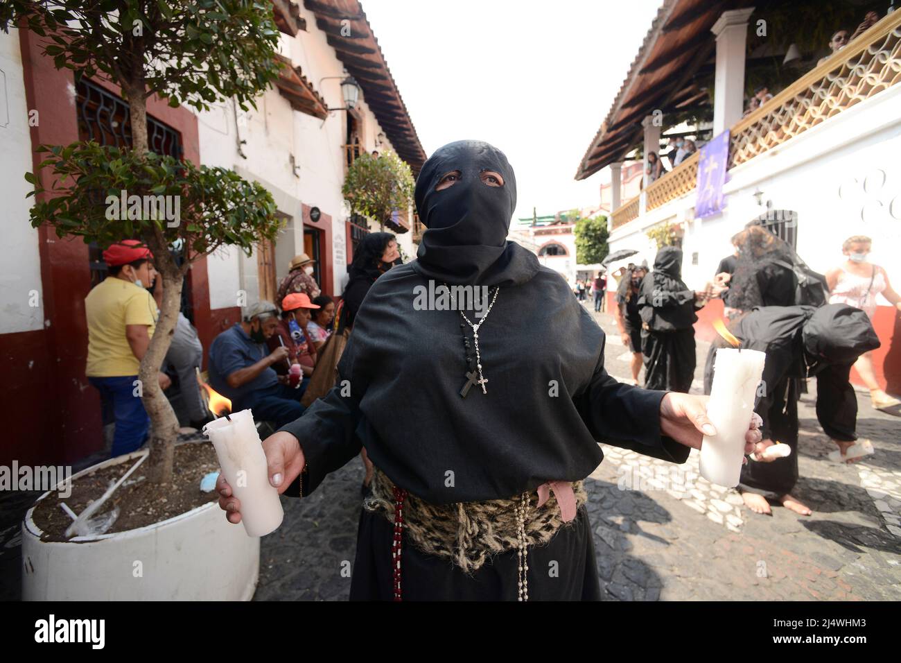 Non Exclusive: TAXCO, MEXICO - APR 15, 2022: A woman penitent wears a ...