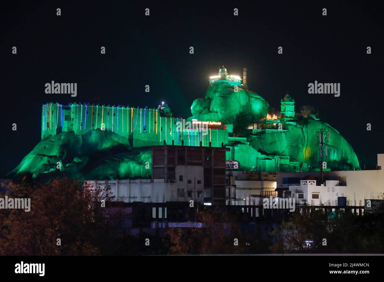 Rockfort Temple and rock are illuminated in different colours during the Purnima (Full Moon) festival  in Trichy, Tamil Nadu, India Stock Photo