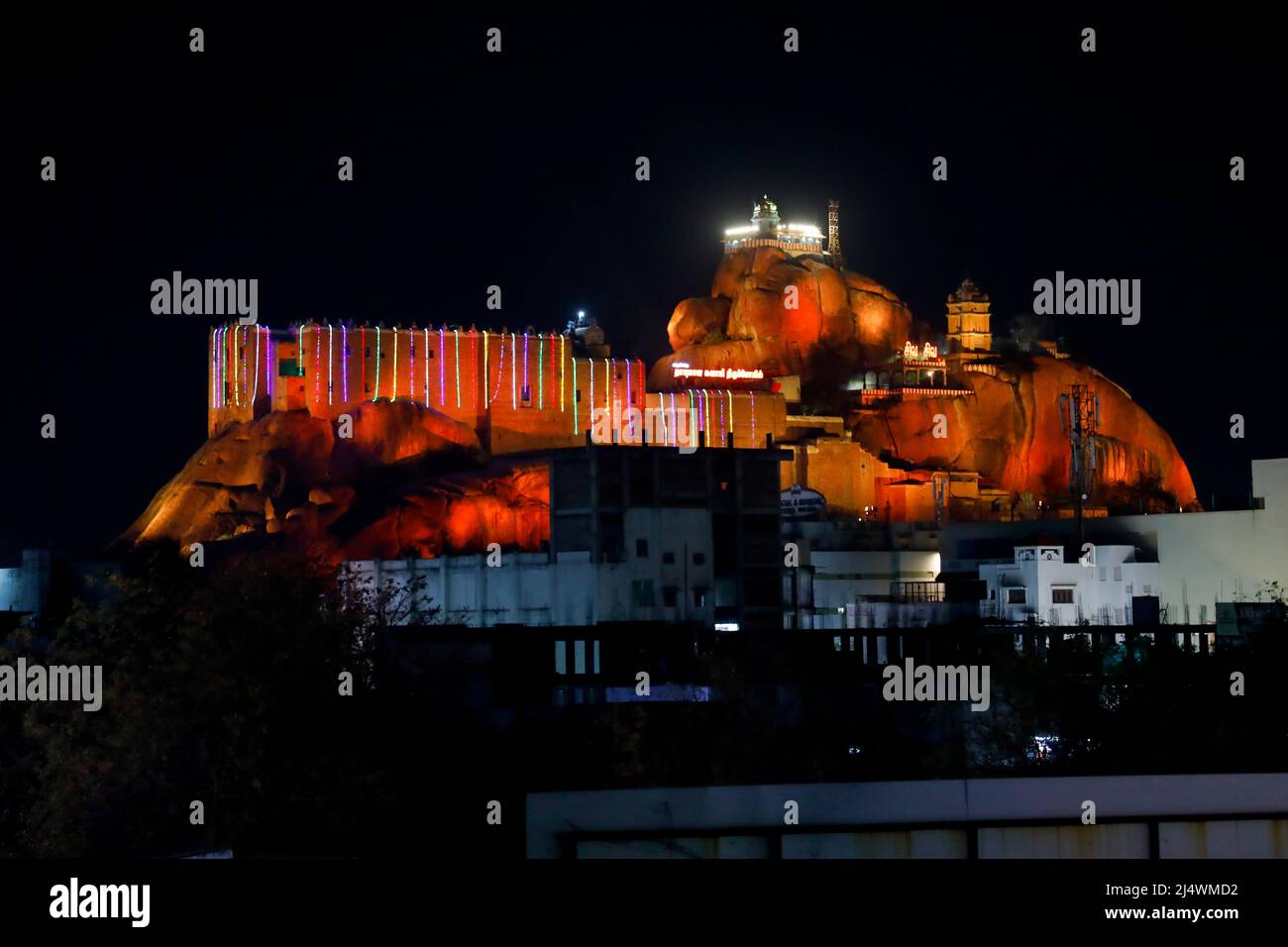 Rockfort Temple and rock are illuminated in different colours during the Purnima (Full Moon) festival  in Trichy, Tamil Nadu, India Stock Photo