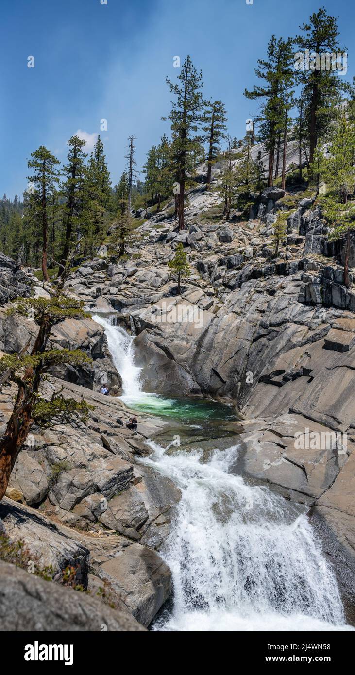 Yosemite Creek cascades into a pool on the Upper Yosemite Falls Trail, in Yosemite National Park, near Merced, California. Stock Photo