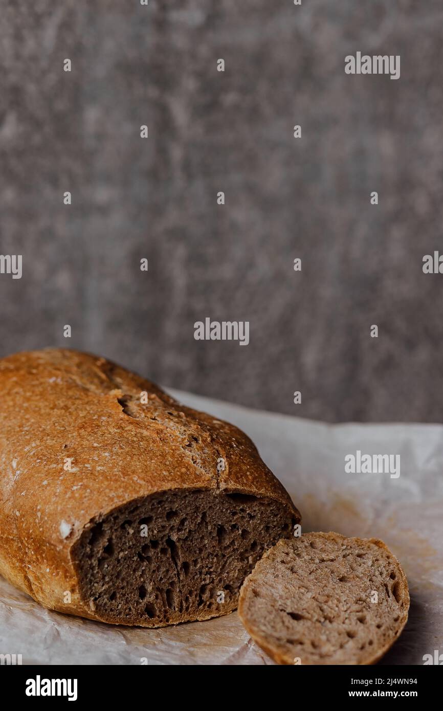 Fresh homemade sourdough bread on a rustic background with copy space
