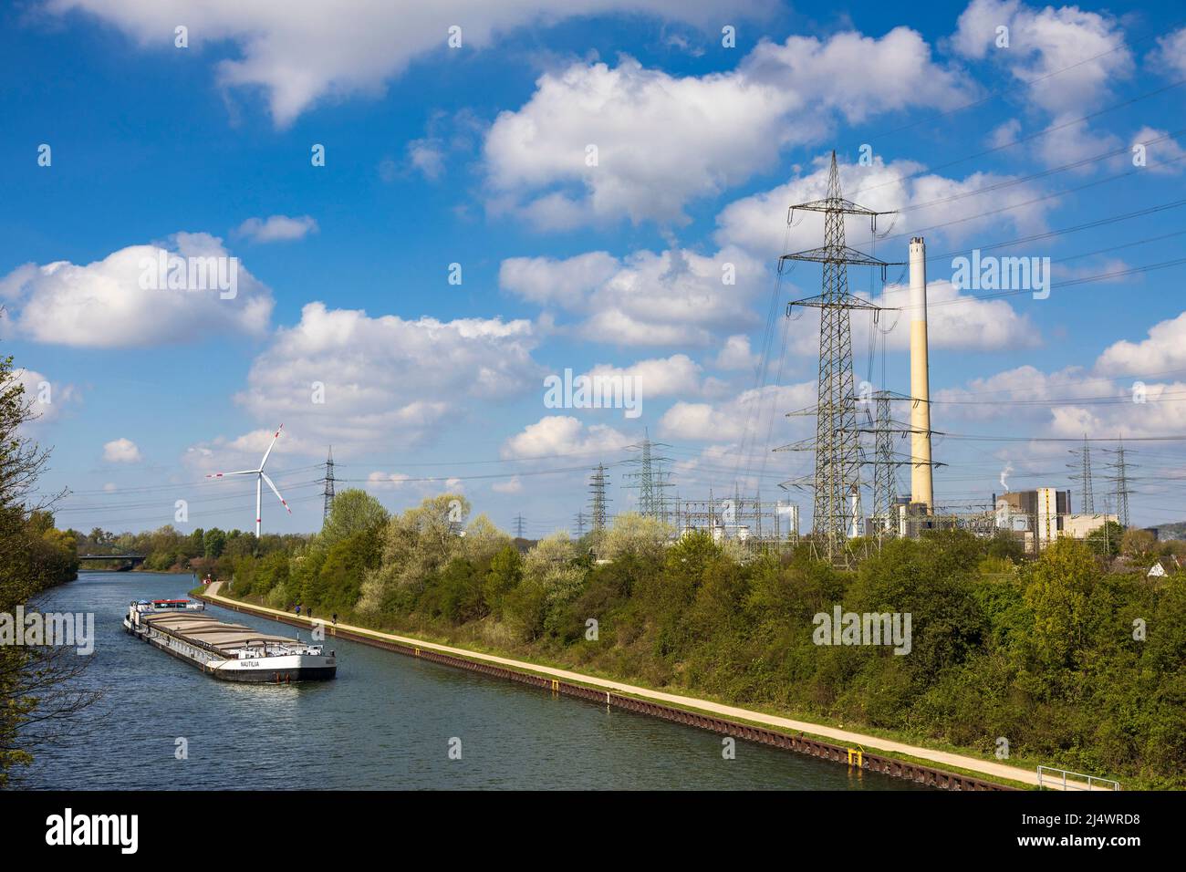 High voltage electricity pylons and power lines near RWE Generation SE waste-to-energy plant with Rhine–Herne Canal, Karnap, Essen, Germany Stock Photo
