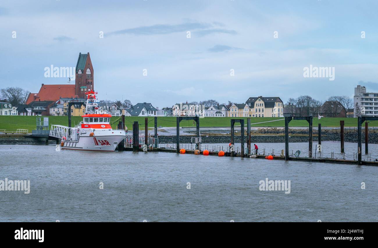 Cuxhaven, Germany - 02.25.2022: Panorama of the city with green flood barrier in the port of Cuxhaven on very early winter morning Stock Photo