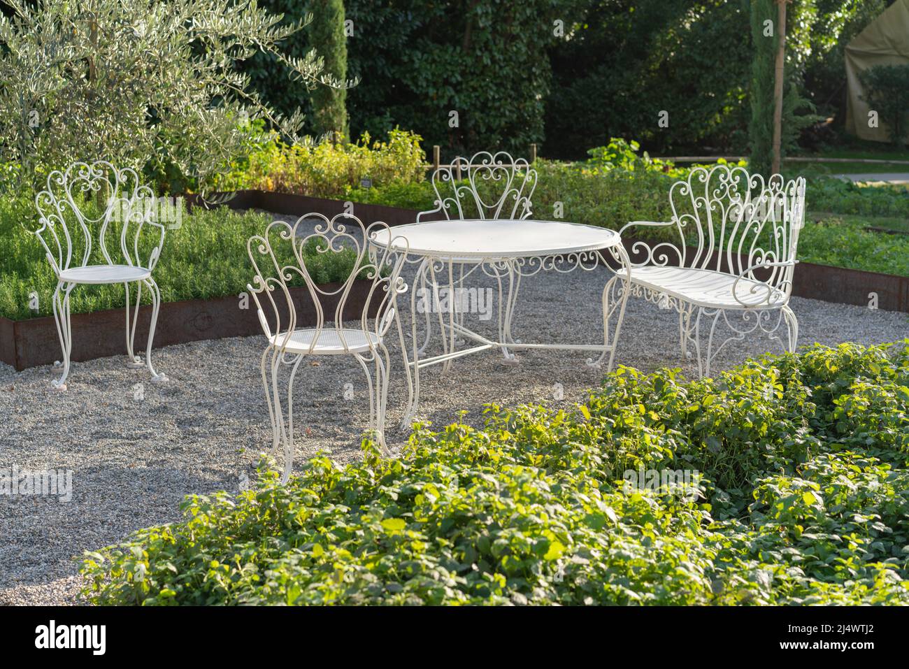 Classic white garden furniture in a garden Stock Photo - Alamy