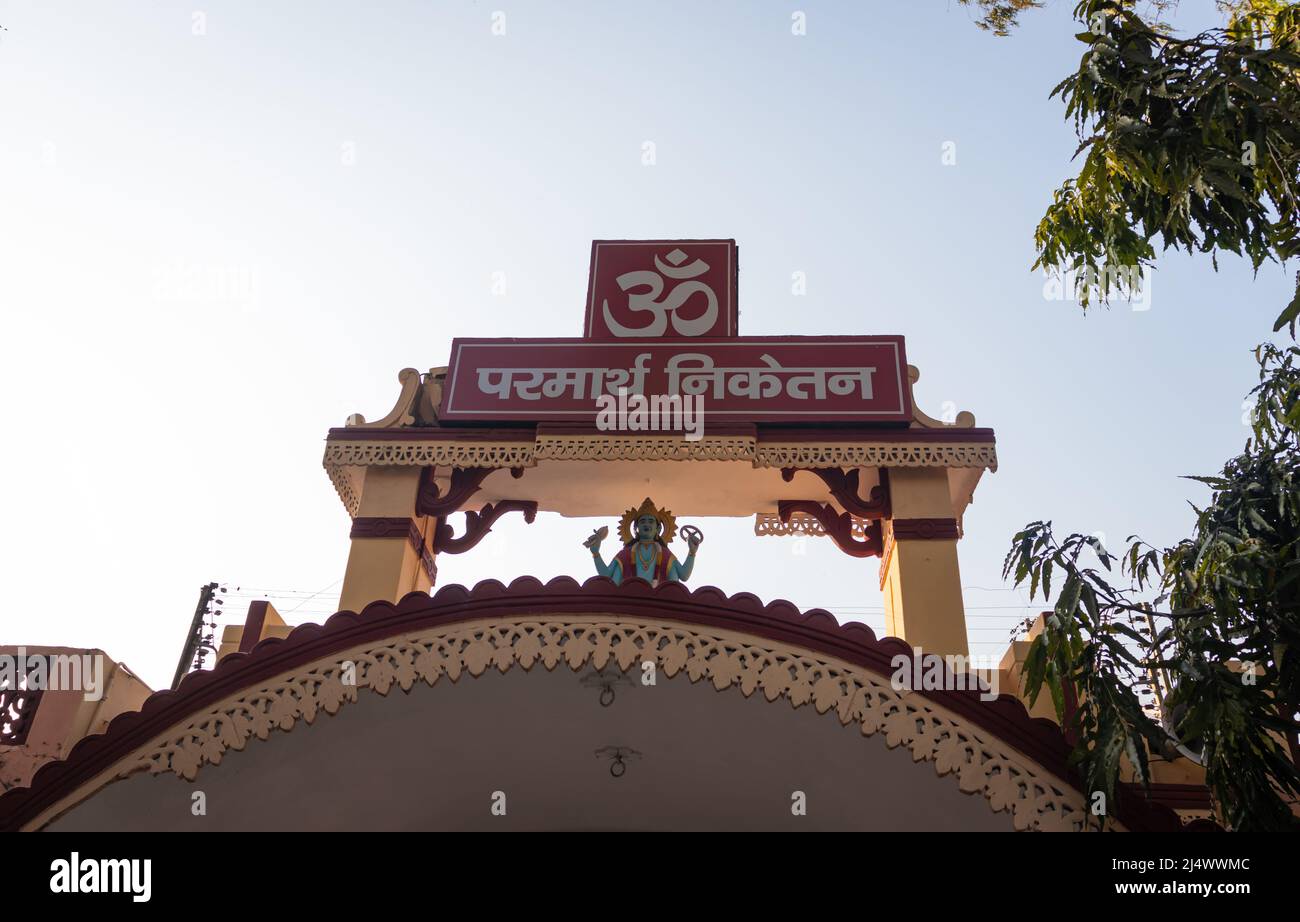 ancient hindu temple top with religious sign at day image is taken at parmarth niketan rishikesh uttrakhand india on Mar 15 2022. Stock Photo