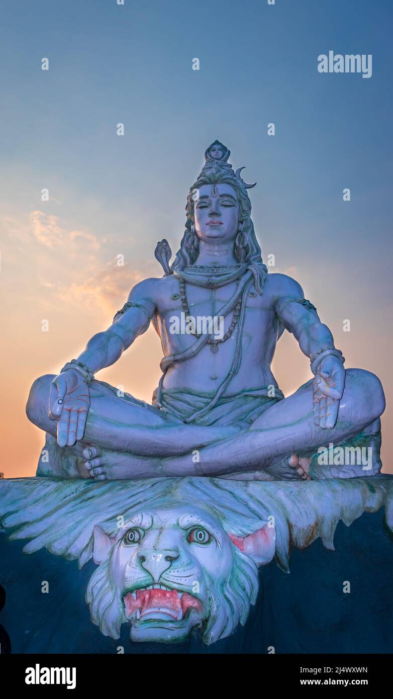 hindu god lord shiva statue in meditation posture with dramatic ...