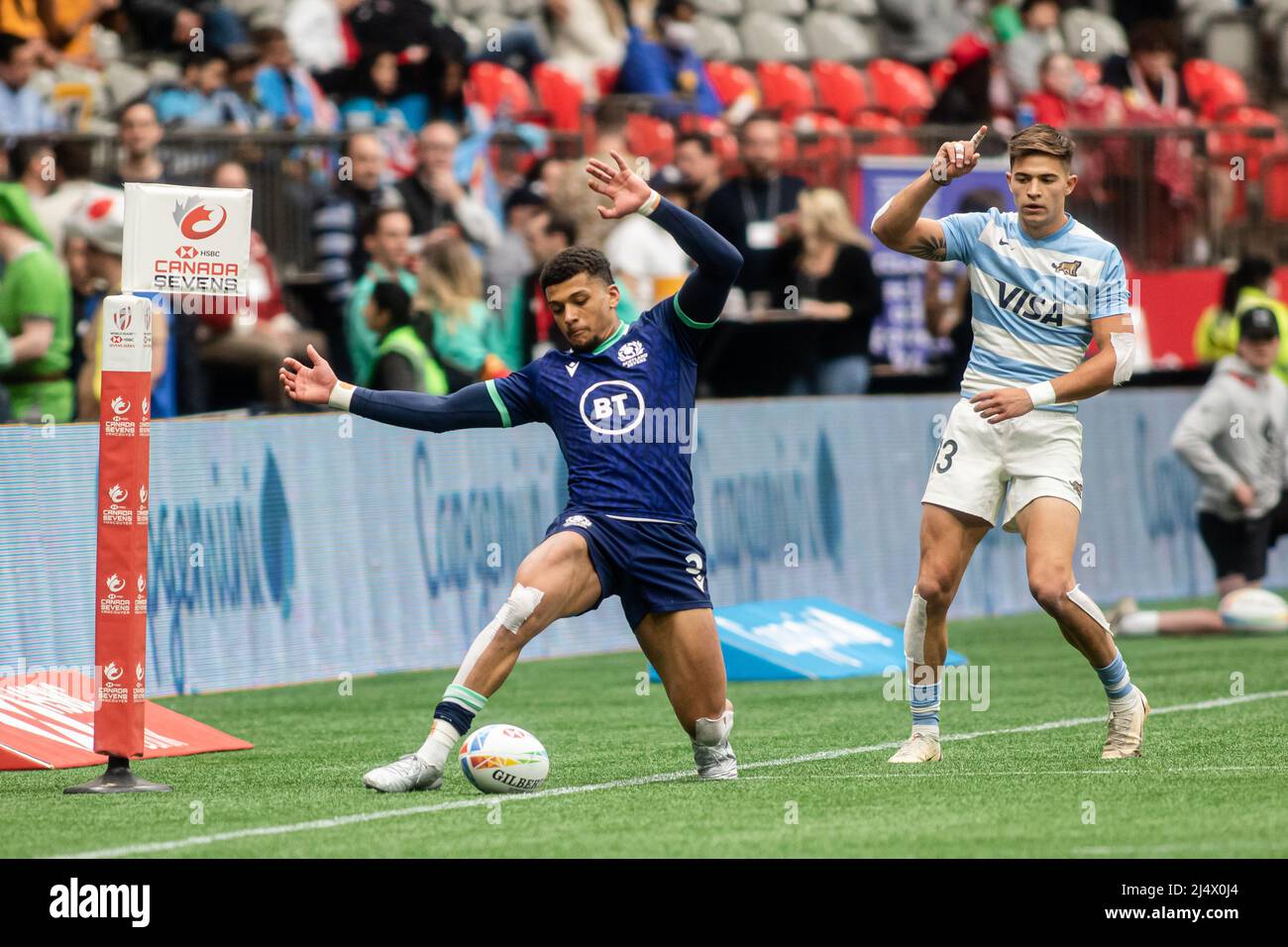 Vancouver, Canada, April 16, 2022: Jacob Henry (left) of Team Scotland 7s tries to keep the ball in play during the match against Team Argentina 7s on Day 1 of the HSBC Canada Sevens at BC Place in Vancouver, Canada. Argentina won the match with the score 24-5. Stock Photo
