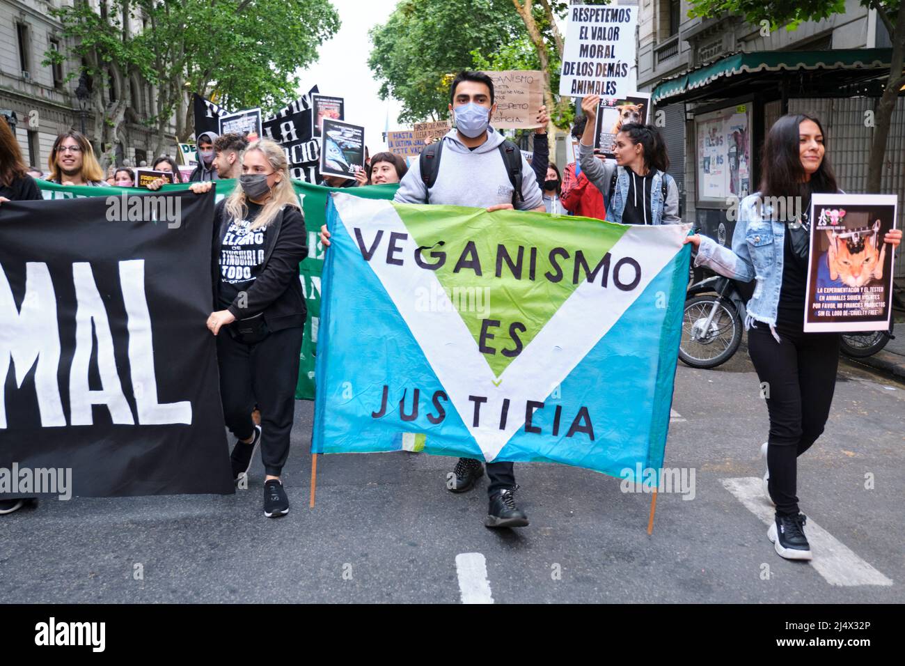Buenos Aires, Argentina; Nov 1, 2021: World Vegan Day demonstration. Young people marching, man holding a banner: Veganism is justice. Stock Photo