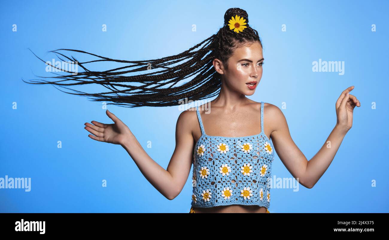 Portrait of beautiful young brunette woman in summer look, hair flying ...