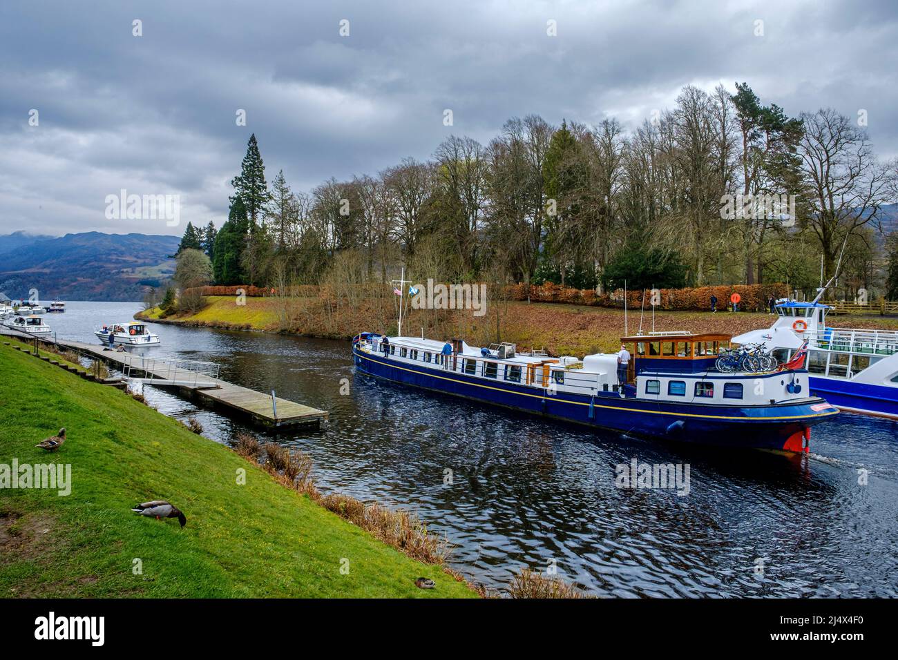The tourist cruiser Scottish Highlander making its way through the Caledonian Canal and into Loch Ness, Scotland Stock Photo