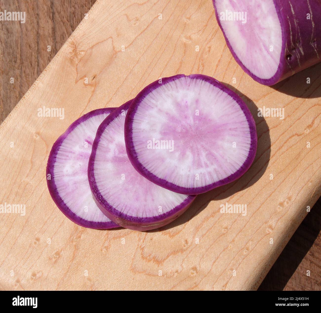 A Purple Ninja Radish Cut in Half Stock Photo Alamy