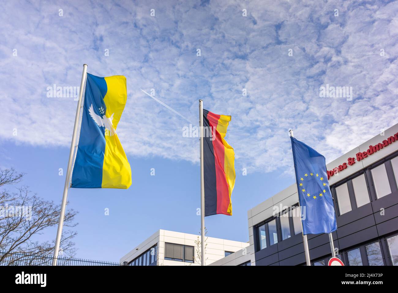 Flags of Ukraine, Germany and the European Union in one row as a sign for solidarity with Ukraine, Berlin, Germany, Europe Stock Photo