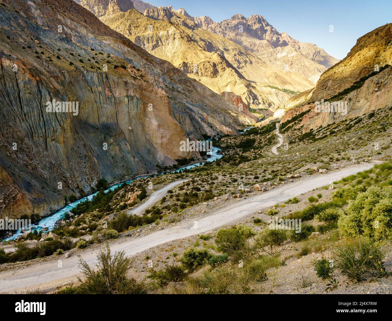 Scenic mountain road to Iskanderkul - an alpine lake in the mountains of Tajikistan Stock Photo