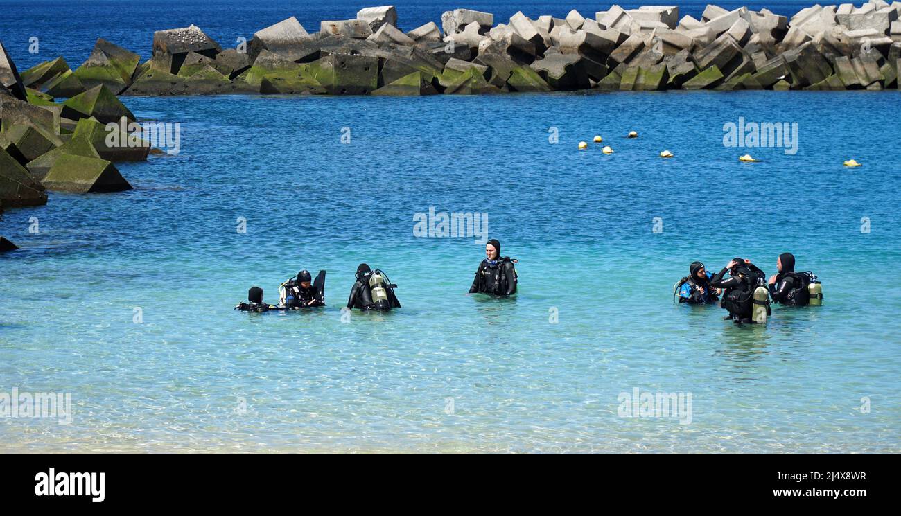 Group of people having a scuba diving lesson. Stock Photo