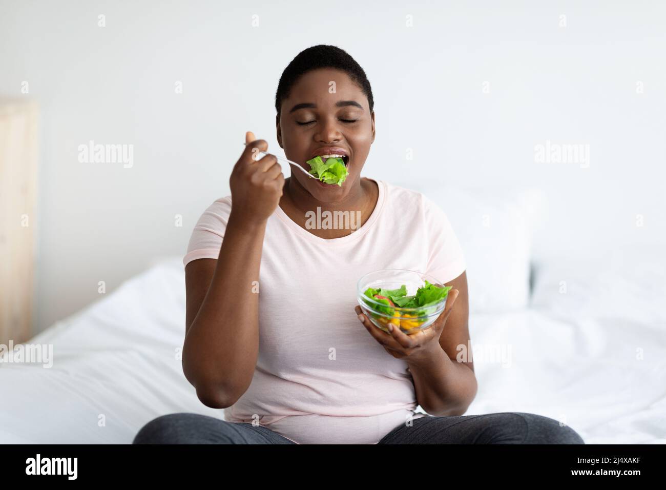 Fat woman eating salad hi-res stock photography and images - Alamy