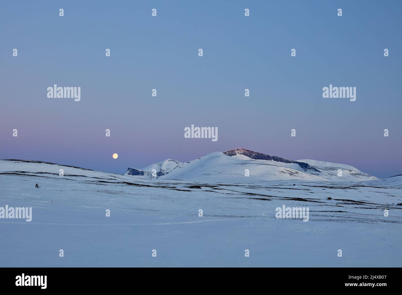 Early morning Easter moonset above Helags mountains in Jämtland, Sweden Stock Photo