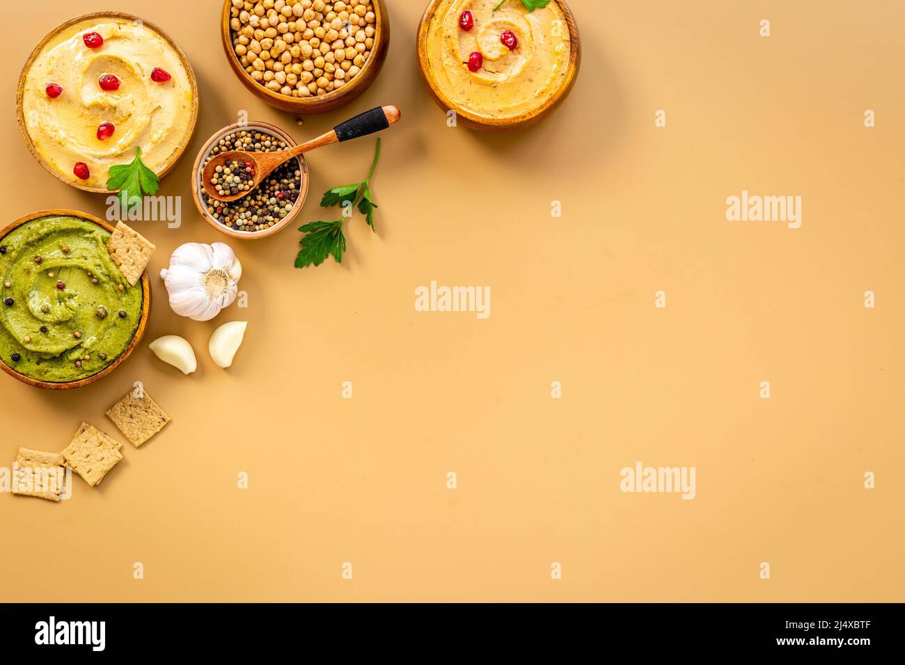 Hummus with snacks set - various types of hummus in bowls Stock Photo ...