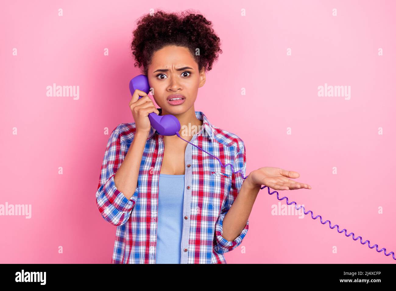 Photo of sad brunette wavy hairdo lady talk telephone wear blue shirt isolated on pink color background Stock Photo