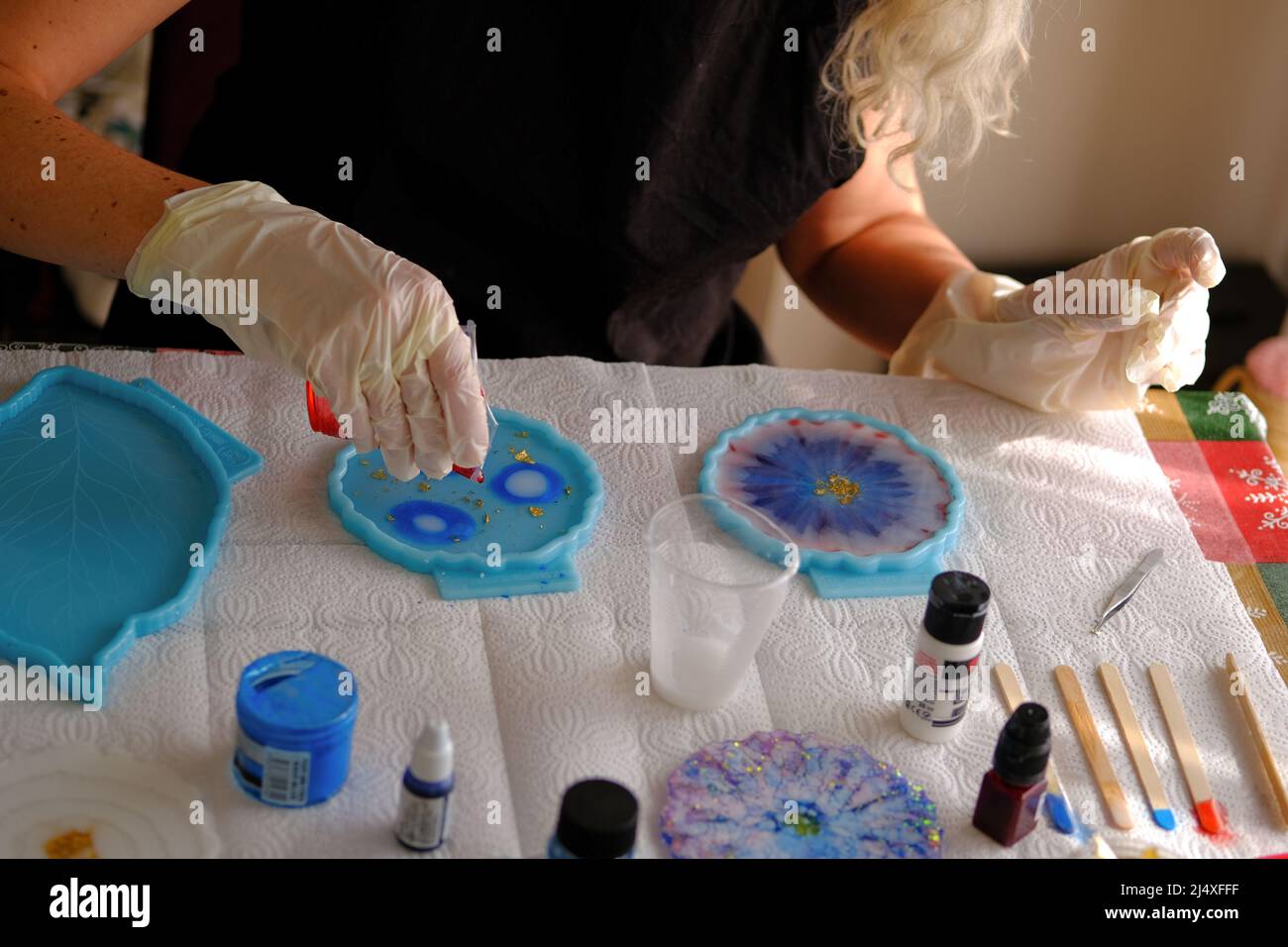 Woman making epoxy resin arts and crafts Stock Photo Alamy
