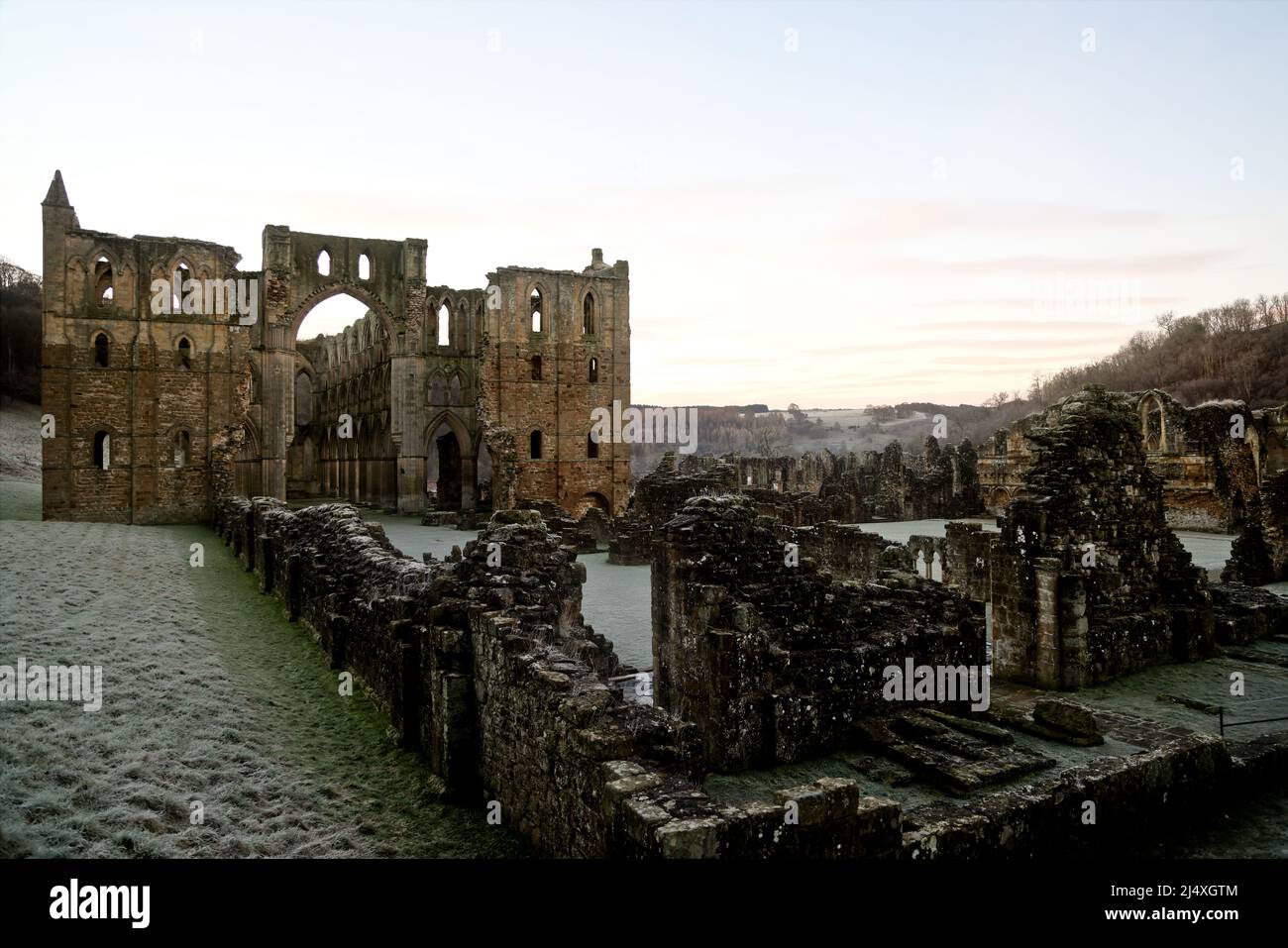 View from Galilee Porch along the Nave to the Presbytery with North & South Transepts of ruined Rievaulx Cistercian Abbey - daybreak Stock Photo