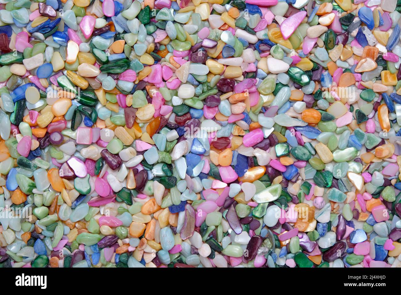 Solid colorful background of pebbles. Textured bright abstract template,  top view, flat lay. Sea stones wallpaper concept Stock Photo - Alamy, image size:1300x956
