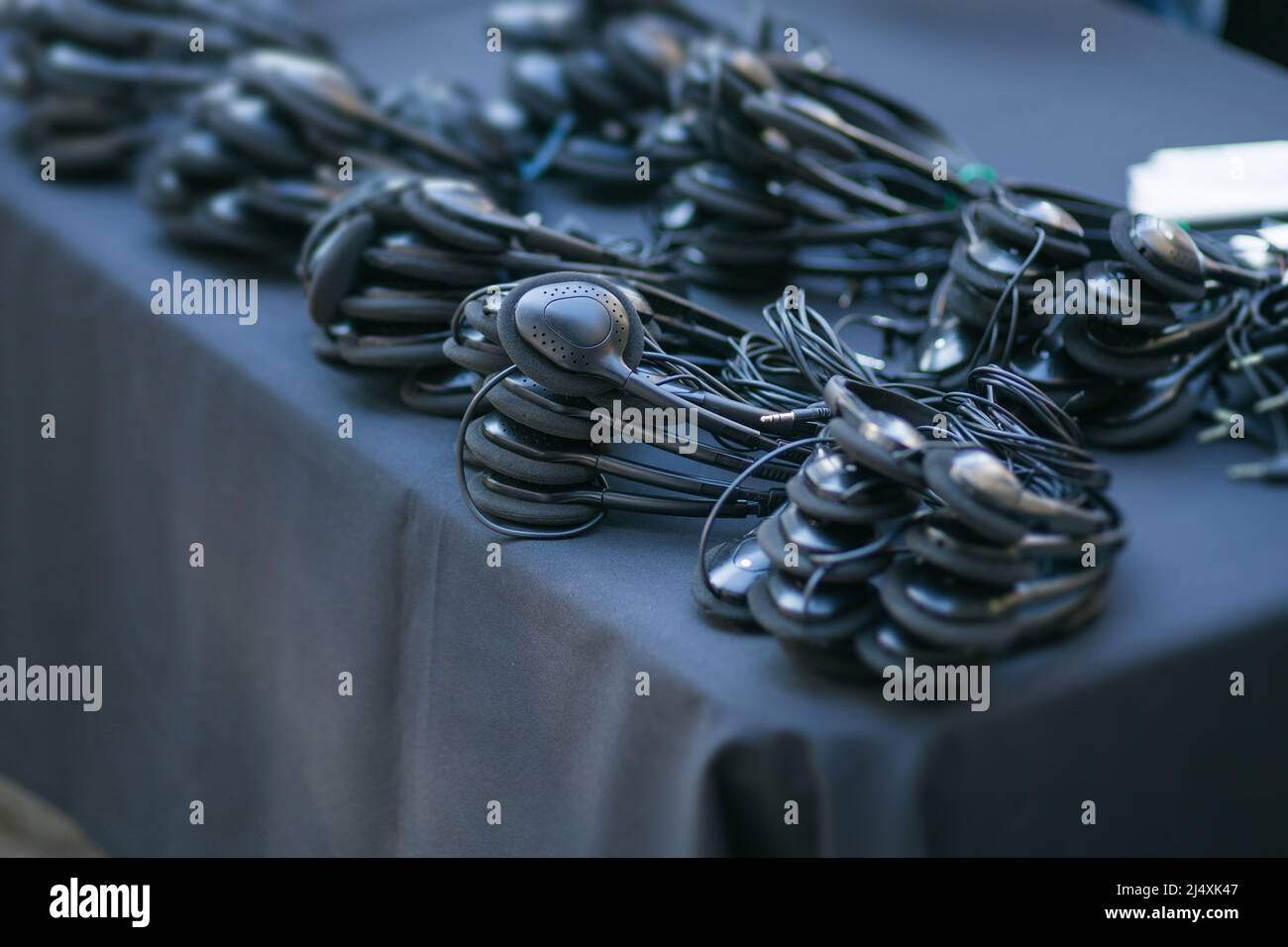 many headphones prepared for a seminar event Stock Photo