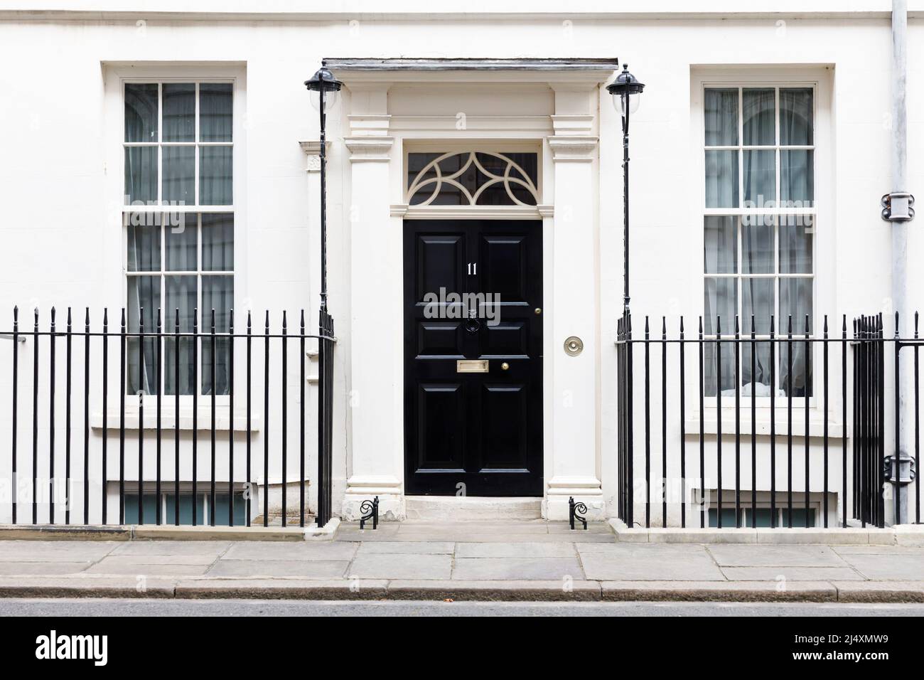 The famous black door at Number 11 Downing Street, traditionally the home of the Chancellor of the Exchequer, Westminster, London, UK Stock Photo