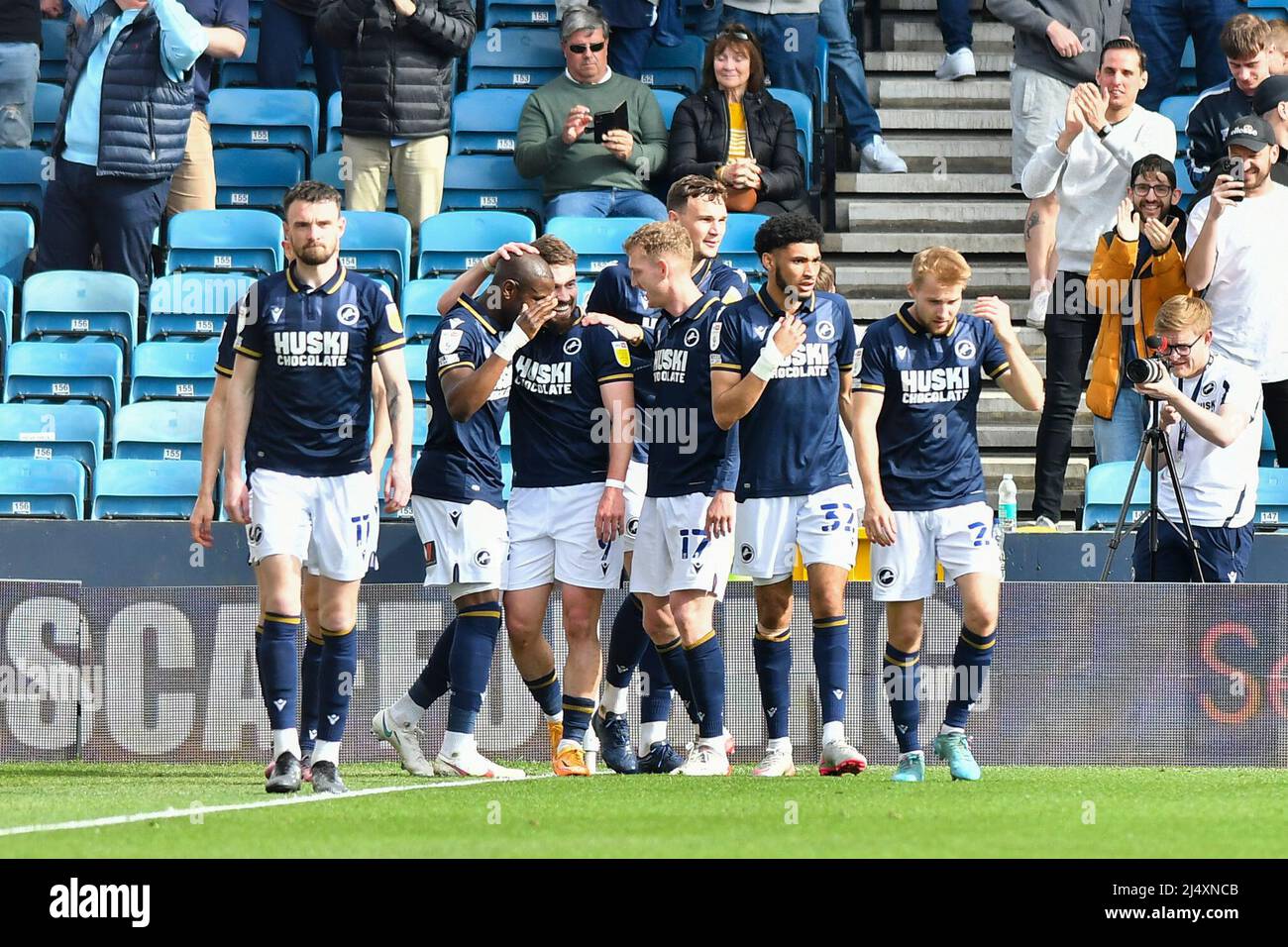 LONDON, UK. APR 18TH Tom Bradshaw of Millwall celebrating with his teammates after scoring his team's second goal during the Sky Bet Championship match between Millwall and Hull City at The Den, London on Monday 18th April 2022. (Credit: Ivan Yordanov | MI News) Credit: MI News & Sport /Alamy Live News Stock Photo