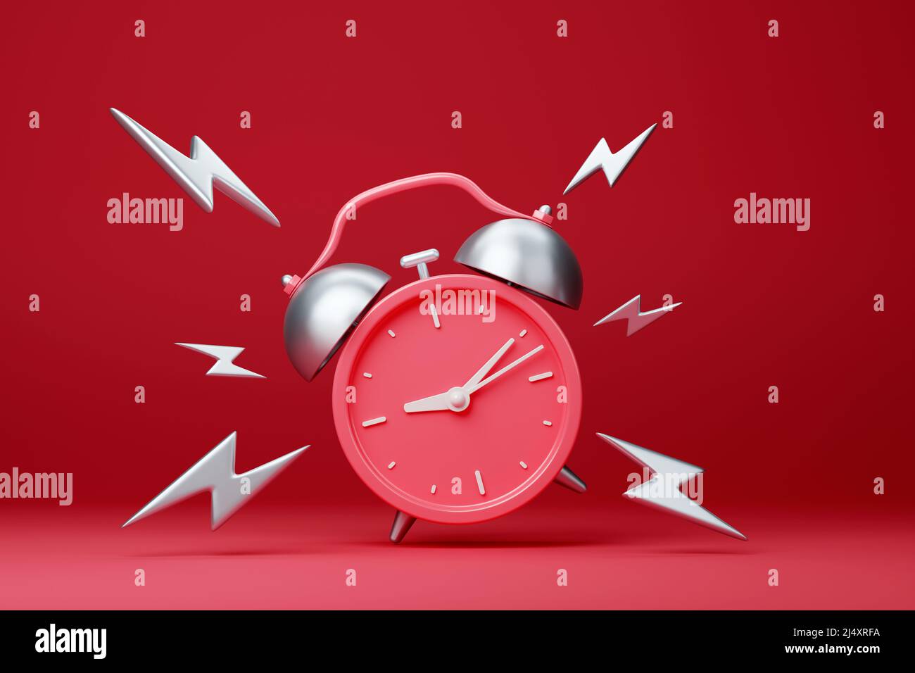 Red vintage ringing alarm clock with silver lightings Stock Photo - Alamy