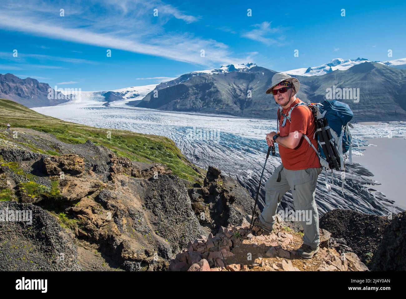 man hiking high above the Skaftafell glacier in south Iceland Stock Photo