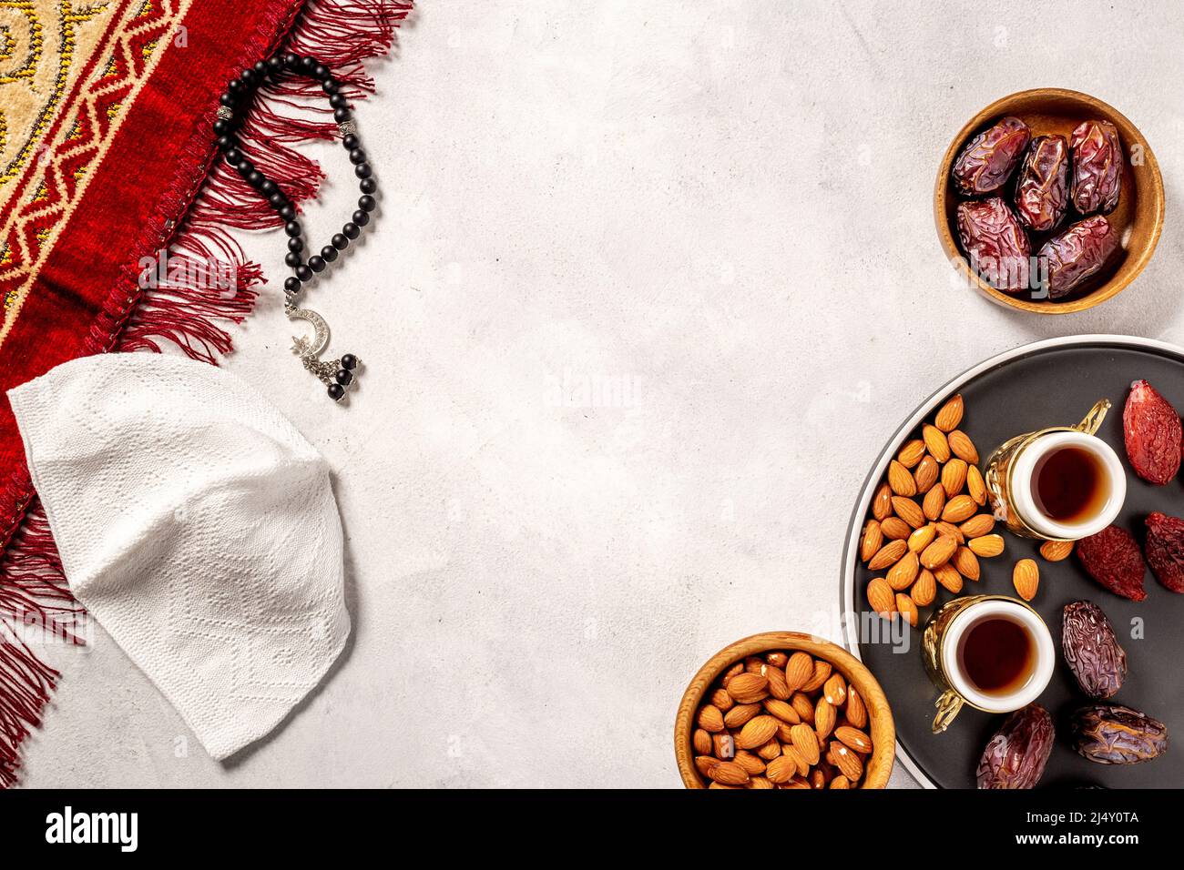 Ramadan background - Islamic prayer carpet with dates and rosary Stock