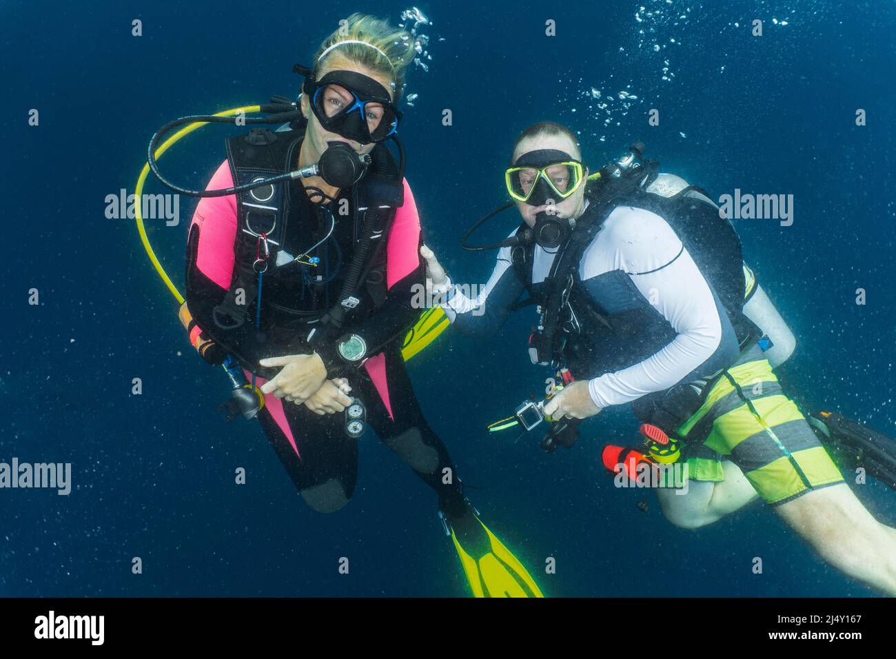 couple performing safety stop while on a dive in the Maldives Stock