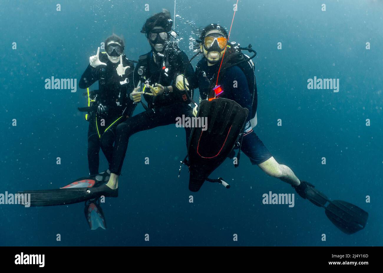 divers at safety stop while on a dive in the Maldives Stock Photo Alamy